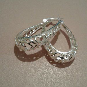 Solid stamped 925 sterling silver hoop earrings. New , never worn.